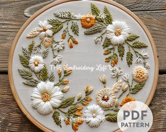 オレンジと白のリースの手刺繍パターン、花のデザイン、花のパターン