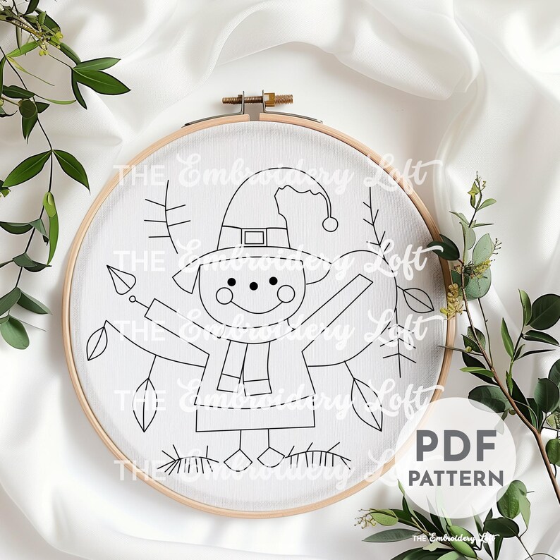 May include: A black and white line drawing of a Christmas elf with a hat and scarf, surrounded by leaves, on a white fabric background in a wooden embroidery hoop. The text "PDF PATTERN" is printed in black on a white background.