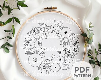 オレンジと白のリースの手刺繍パターン、花のデザイン、花のパターン