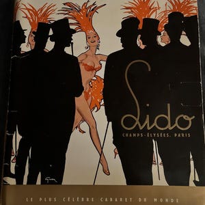 May include: A vintage poster advertising the Lido cabaret in Paris, France. The poster features a silhouetted group of men in top hats and a woman in a red and orange feathered headdress. The text on the poster reads "Lido Champs-Élysées Paris Le Plus Célèbre Cabaret Du Monde".