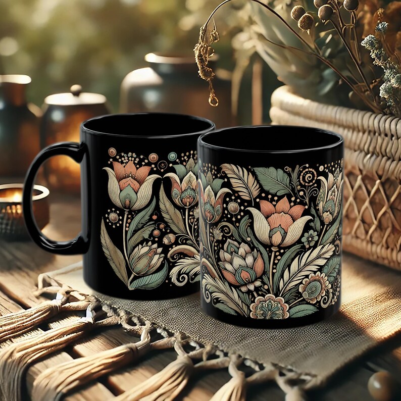 Black ceramic mug featuring a tulip floral design, ideal for tea or coffee enthusiasts. Boho-style artisan coffee cup for bohemian kitchen decor or vintage-inspired gift ideas. A charming addition to your daily routine or a thoughtful present for her