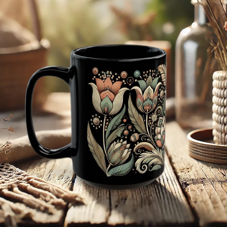 Boho black ceramic coffee mug with tulip floral design, perfect for tea or coffee lovers. Artisan drinkware for vintage-inspired kitchens or bohemian decor. Makes a unique gift for her or a decorative piece for retro and artistic home settings.