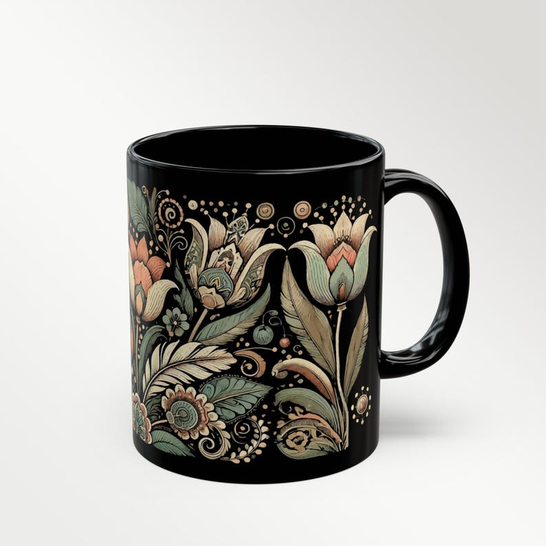 Boho black ceramic coffee mug with tulip floral design, perfect for tea or coffee lovers. Artisan drinkware for vintage-inspired kitchens or bohemian decor. Makes a unique gift for her or a decorative piece for retro and artistic home settings.