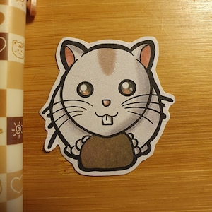 Söt och bedårande klistermärke med hamster