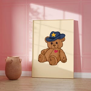 Retro teddy bear cowboy print for nursery or dorm decor, perfect for vintage wall art lovers, Western art themes, and playful apartment wall decor. Printable wall art featuring a cute bear with a cowboy hat.