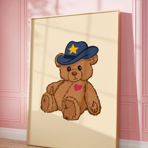 Retro teddy bear cowboy print for nursery or dorm decor, perfect for vintage wall art lovers, Western art themes, and playful apartment wall decor. Printable wall art featuring a cute bear with a cowboy hat.