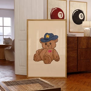 Retro teddy bear cowboy print for nursery or dorm decor, perfect for vintage wall art lovers, Western art themes, and playful apartment wall decor. Printable wall art featuring a cute bear with a cowboy hat.