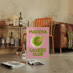 Pink matcha printable wall art featuring Matcha Lovers Club typography with a green matcha bowl and bamboo whisk on a bright pink background, ideal for matcha wall art, matcha print, tea lover gift, kitchen wall art, kitchen print, coffee bar decor, pink wall art, green wall art, cute wall art, girly wall art, dopamine decor and apartment decor.