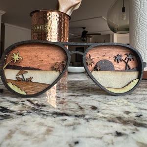 Wooden Sunglasses Wall Art with Tropical Beach Sunset Scene – Handcrafted Rustic Décor, Perfect for Coastal or Boho Homes