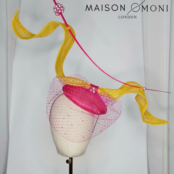 Fushia and yellow fascinator with veil