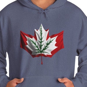 May include: A blue hoodie with a red and white Canadian flag design featuring a green marijuana leaf in the centre.