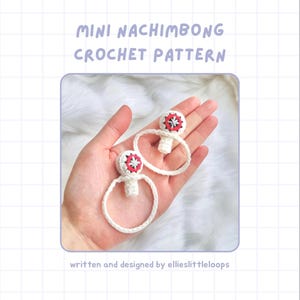 May include: A pair of white crochet earrings with red and black detailing. The image features the text "MINI NACHIMBONG CROCHET PATTERN" and "written and designed by ellieslittleloops."