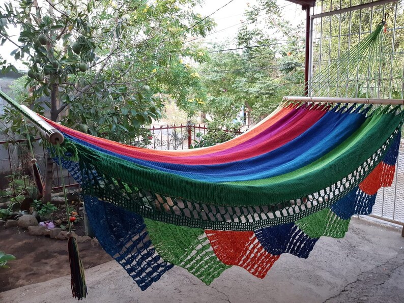 Colorful handwoven hammock nicaragua. They measure 140 inches long in their in-use position by 48 inches wide. The poles are made of cedar. Hammock made of manila cotton thread.