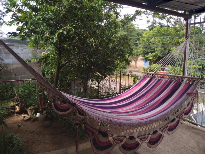 Colorful handwoven hammock nicaragua. They measure 140 inches long in their in-use position by 48 inches wide. The poles are made of cedar. Hammock made of manila cotton thread.