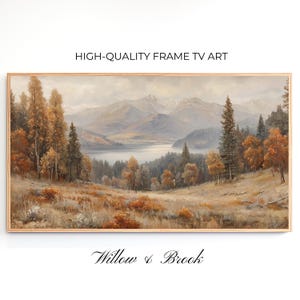 May include: A framed landscape painting depicting a mountain scene with a lake and trees in autumnal hues. The artwork is labelled "HIGH-QUALITY FRAME TV ART" and "Willow & Brook."