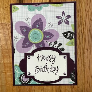 Birthday card, black and purple floral top fold.