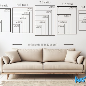 May include: A beige sofa measuring 85 inches wide positioned below a wall display of five black rectangular frames. Each frame contains multiple nested rectangles labeled with aspect ratios and dimensions in inches and centimeters.
