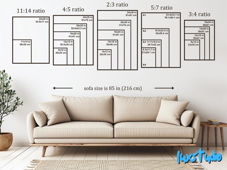 May include: A beige sofa measuring 85 inches wide positioned below a wall display of five black rectangular frames. Each frame contains multiple nested rectangles labeled with aspect ratios and dimensions in inches and centimeters.