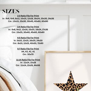 May include: A chart with different print sizes in inches and centimeters. The chart lists the sizes for 2:3, 3:4, 4:5, 5:7, and 11:14 aspect ratios. The chart is on a white background with a wooden frame around it. A leopard print star is visible in the frame.