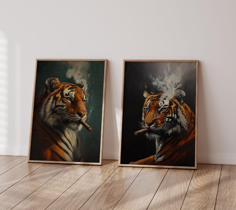 May include: Two framed prints of a tiger with a cigar in its mouth. The tiger in the left print has a dark green background, while the tiger in the right print has a dark gray background. Both tigers have smoke coming from the cigar.