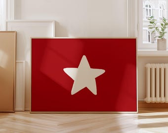 Può includere: Una stampa su tela rossa con una stella bianca al centro. La stella è un design semplice e disegnato a mano.