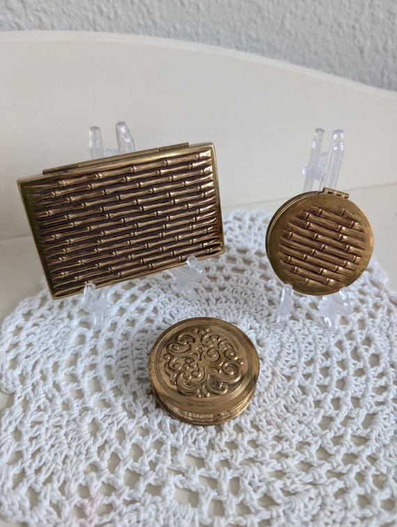 Three vintage Avon rouge,powder compacts from the 1930's. 2 are a set.