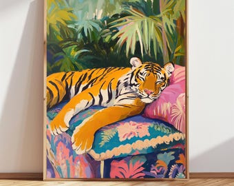 May include: A painting of a tiger sleeping on a colorful patterned cushion. The tiger is orange and black with white stripes. The cushion is surrounded by lush green foliage.