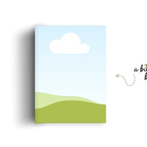 May include: A book cover with a blue sky, white cloud, and green hills. The text "a bit bigger book" is on the right side of the cover.