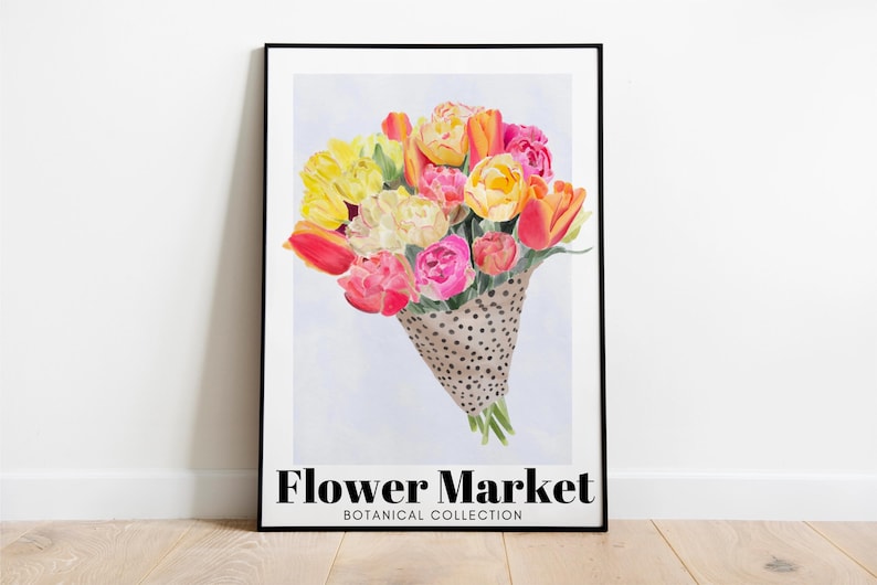 May include: A framed art print featuring a watercolor bouquet of tulips in shades of yellow, orange, and pink, presented in a dotted cone. The words "Flower Market" and "Botanical Collection" are printed at the bottom.