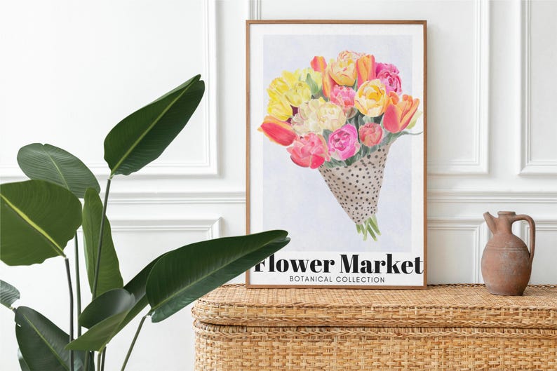 May include: A framed art print featuring a watercolor bouquet of tulips in shades of yellow, pink, and orange, presented in a dotted cone. The print is labeled "Flower Market, Botanical Collection."