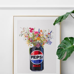 May include: A framed print featuring a black Pepsi Max can filled with a vibrant bouquet of colorful wildflowers. The Pepsi logo is prominently displayed on the can.