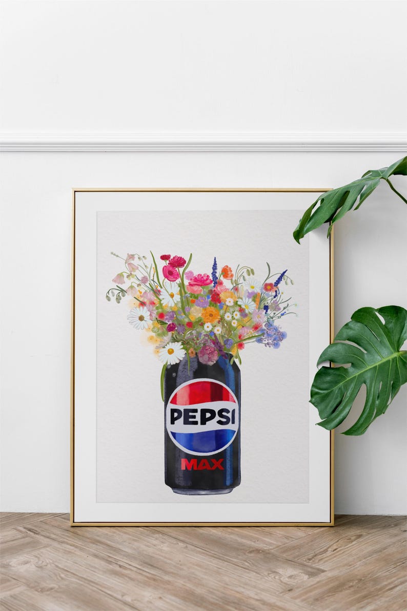 May include: A framed print featuring a black Pepsi Max can filled with a vibrant bouquet of colorful wildflowers. The Pepsi logo is prominently displayed on the can.