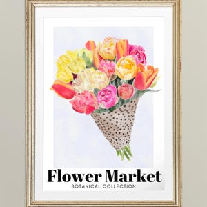 May include: A framed print featuring a watercolor bouquet of tulips in shades of yellow, pink, and orange. The flowers are wrapped in a brown paper cone with black polka dots. The text "Flower Market" and "Botanical Collection" are displayed below the bouquet.