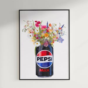 May include: A framed watercolor print featuring a Pepsi Max can filled with a vibrant bouquet of flowers. The can is black with the Pepsi logo in red, white, and blue. The flowers include pink, yellow, and purple blooms.