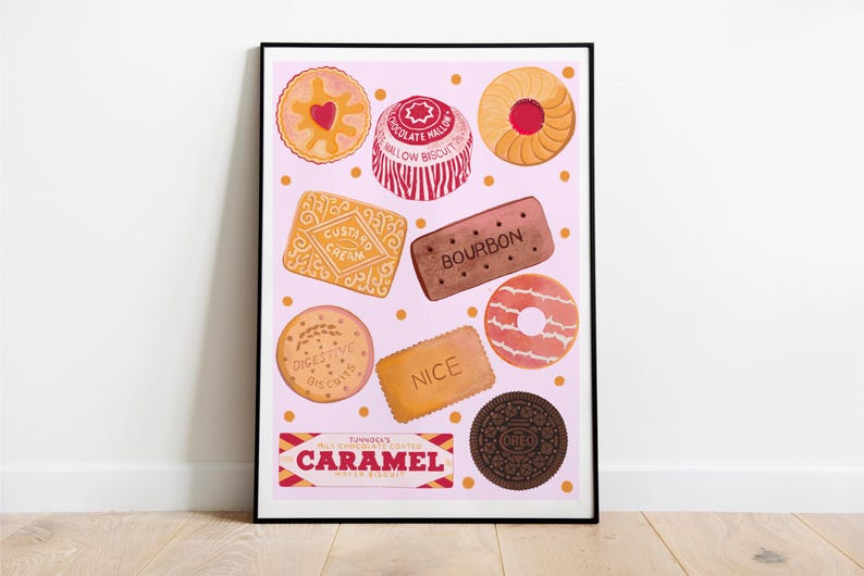 May include: A framed print featuring a collection of illustrated biscuits on a pink background. The biscuits include custard creams, bourbons, and digestives. The print also includes the text "CARAMEL".