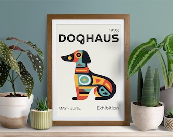 May include: A framed poster with a geometric design of a dog in red, yellow, blue, and black. The poster is titled "DOQHAUS 1923" and has the text "MAY - JUNE Exhibition" at the bottom.