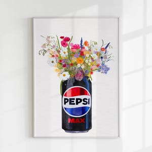 May include: A framed art print featuring a black Pepsi Max can filled with a vibrant bouquet of colorful wildflowers. The Pepsi can has a red, white, and blue logo. The flowers include daisies, pink, orange, and purple blooms.