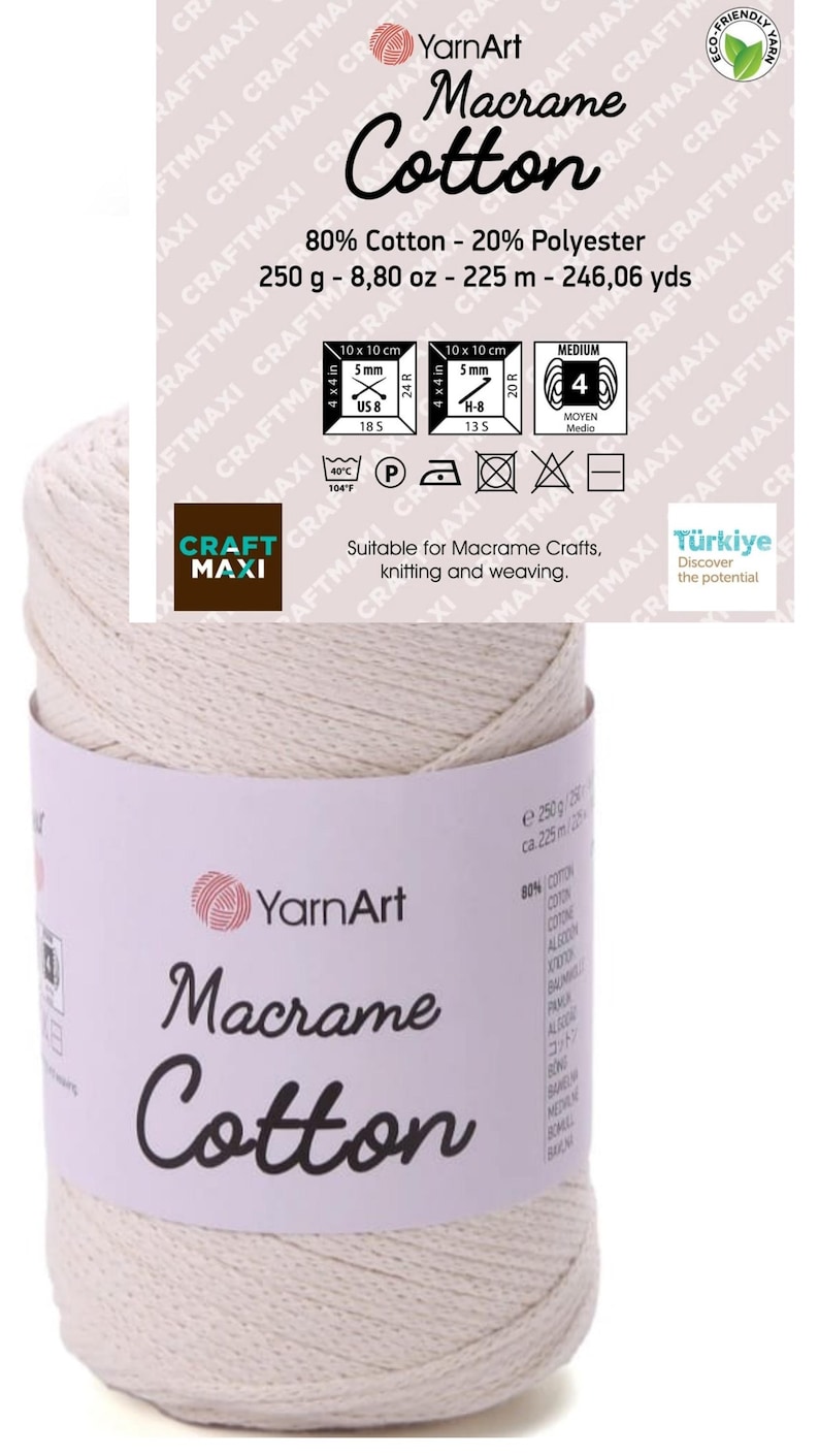 May include: A spool of off-white YarnArt Macrame Cotton cord with a paper label. The label displays 80% Cotton, 20% Polyester, 250 g, 8.80 oz, 225 m, and 246.06 yds. It includes care icons, a size 4 knitting needle symbol, and text for crafting.