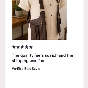 May include: A dark brown leather shoulder holster bag with adjustable straps and metal hardware, worn over a short-sleeved cream-colored button-down shirt. The bag features multiple zippered compartments and pockets for storage on the front side.