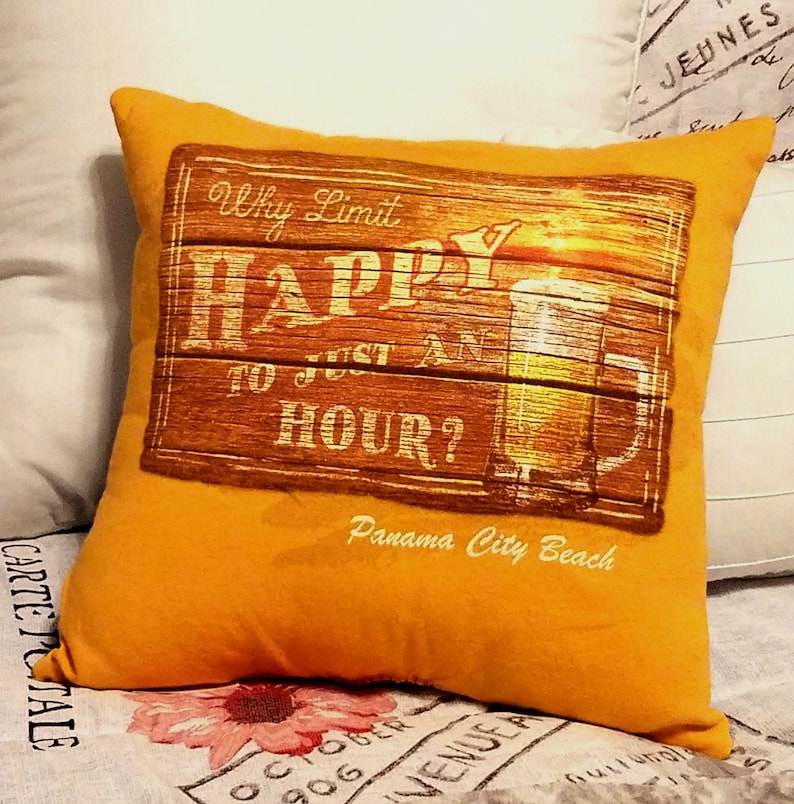 Mustard yellow square memory pillow made from a T shirt with a wooden sign design. The sign reads "Why Limit HAPPY to Just An HOUR?" with a beer mug graphic and "Panama City Beach" text.