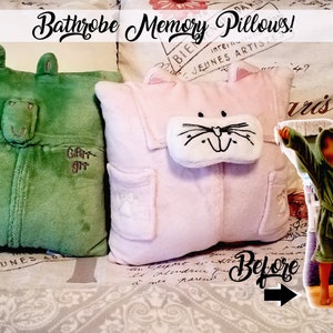 Two plush pillows made from bathrobes. One is green with a frog face, the other is pink with a cat face. The image includes the text "Bathrobe Memory Pillows!" and a photo of children in bathrobes.