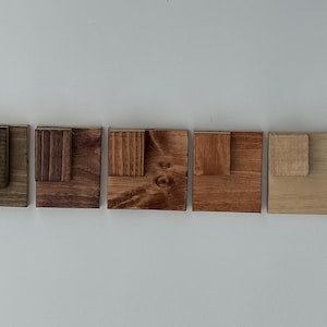 LEFT TO RIGHT - Ebony, Kona, dark walnut, American walnut, cherry.