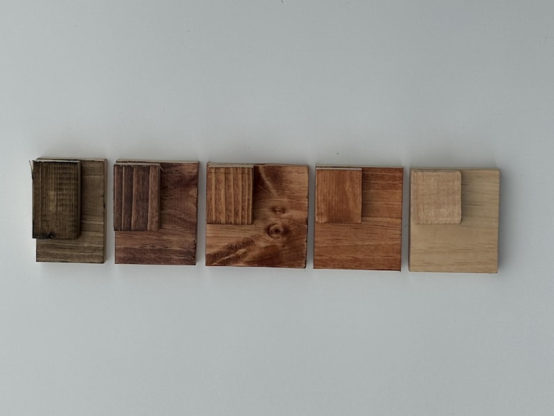 LEFT TO RIGHT - Ebony, Kona, dark walnut, American walnut, cherry.