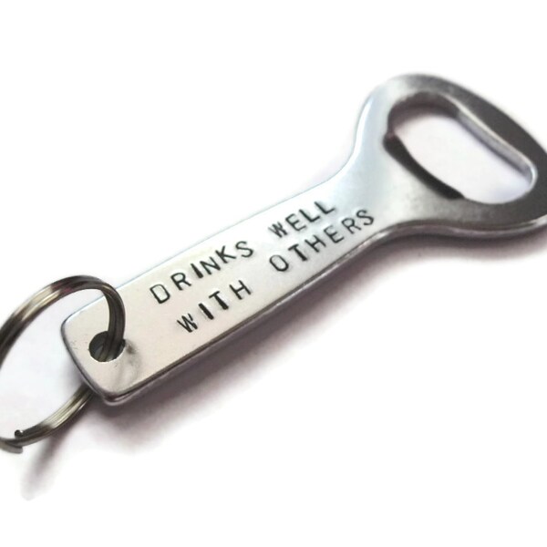 Custom Handstamped bottle opener keychain ..drinks well with others