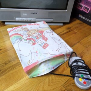 Rainbow Brite console dust cover, handmade from vintage children’s bed sheet - WRETRO WRAPPER