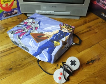 Yu-Gi-Oh console dust cover, handmade from vintage children’s bed sheet - WRETRO WRAPPER