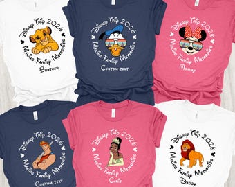 May include: Six short-sleeved t-shirts with Disney character designs. Each shirt has a circular design with the text "Disney Trip 2026" and "Making Family Memories." The shirts are white, navy blue, and pink, with different character illustrations.