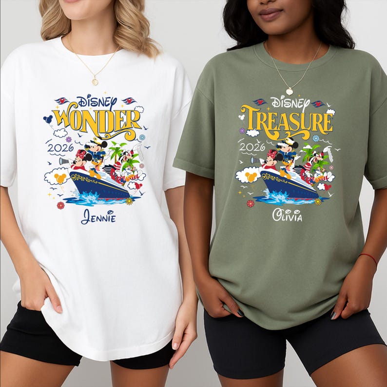 May include: Two t-shirts, one white and one olive green, featuring a Disney cruise design. The white shirt says "Disney Wonder 2026" with a ship graphic and the name "Jennie". The green shirt says "Disney Treasure 2026" with a ship graphic and the name "Olivia".