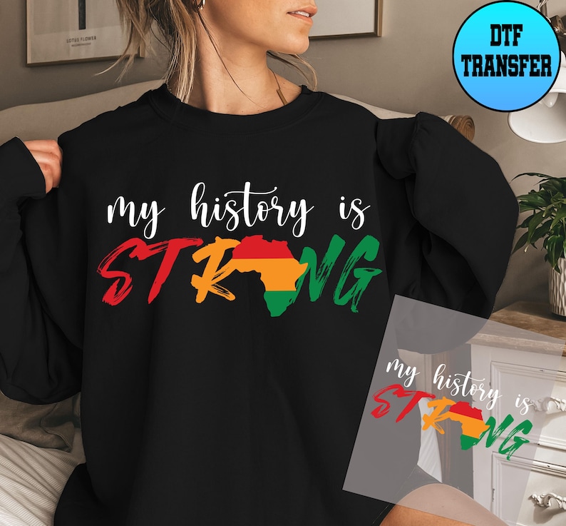 May include: Black sweatshirt with the text "my history is STRONG" in white with a red, yellow, and green outline of the continent of Africa. The sweatshirt is being modelled by a person.
