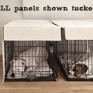 May include: Two dog crates with white fabric covers tucked under the top of the crates. The text "4 FULL panels shown tucked under" is visible at the top of the image.